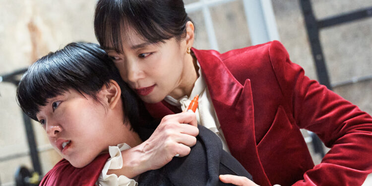 Jeon Do-yeon as Gil Bok-soon choking Lee Yeon as Kim Yeong-ji in the movie Kill Boksoon
