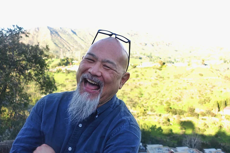 Portrait of Michael Fukushima laughing.