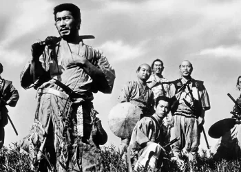 Toshiro Mifune as Kikuchiyo from Seven Samurai standing in a field in front of five other men