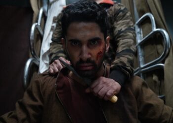 Close up of Lakysha as Amrit with a knife to his neck from the movie Kill.