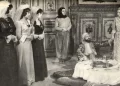 A film still from Ver Elini Istanbul showing several characters gathered in a dining room.