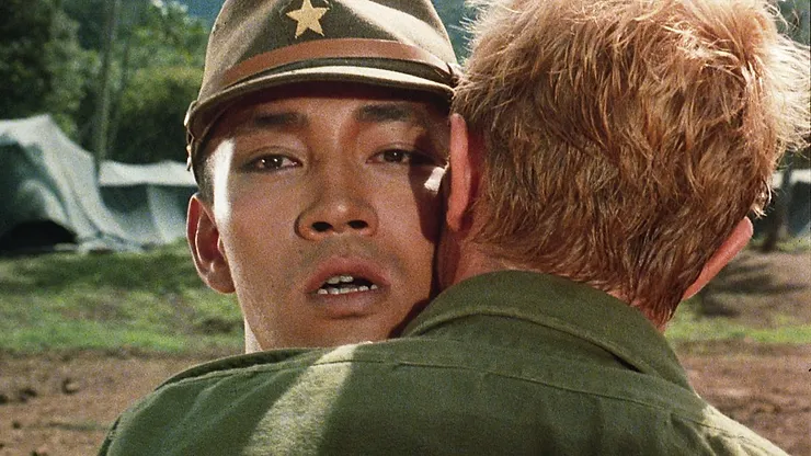 Ryuichi Sakamoto as Capt. Yonoi being hugged by David Bowie as Maj. Jack "Strafer" Celliers in Merry Christmas Mr. Lawrence.