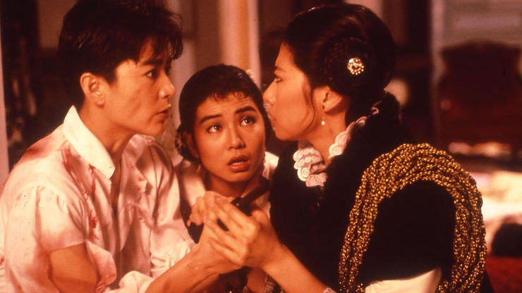Brigitte Lin as Tsao Wan, Cherie Chung as Sheung Hung and Sally Yeh as Bai Niu stare at each other with urgency in Peking Opera Blues.