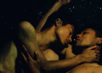 Thi Nga Nguyen as Hoa and Daniel Viet Tung Le as Ba embrace one another in Viet and Nam