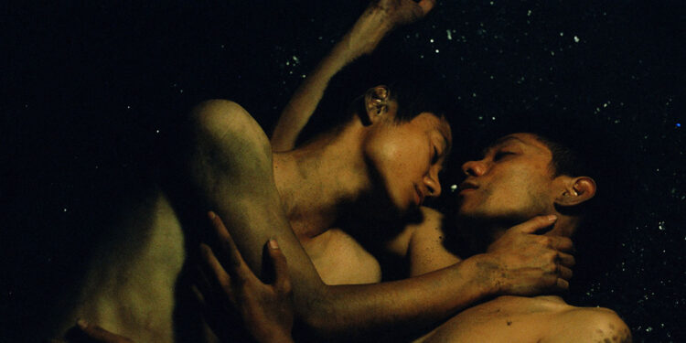 Thi Nga Nguyen as Hoa and Daniel Viet Tung Le as Ba embrace one another in Viet and Nam