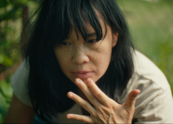 Sook-Yin Lee as Marielle Lau with her hand to her mouth in the short film 'A Fermenting Woman.'