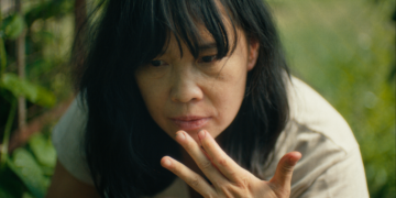 Sook-Yin Lee as Marielle Lau with her hand to her mouth in the short film 'A Fermenting Woman.'