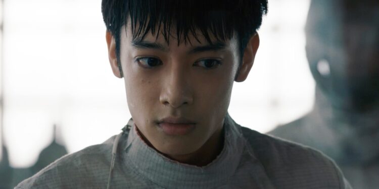 A medium close-up of Liu Hsiu-Fu as Zijie in Pierce, dressed in a white fencing uniform.