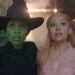 A medium close-up of Cynthia Erivo as Elphaba and Ariana Grande as Galinda in Wicked, as they stare up in awe of Emerald City.