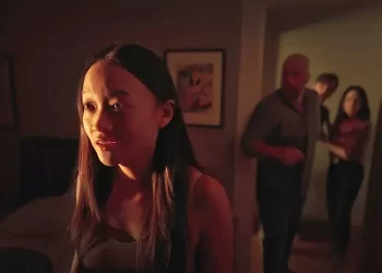 Callina Liang as Chloe in Steven Soderbergh's "Presence" looks toward the camera in fear.