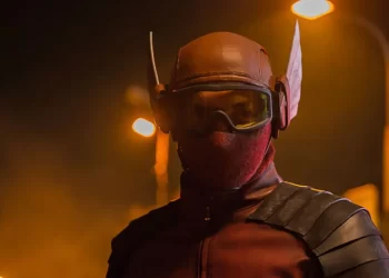 Abimana Aryasatya as Sancaka wearing a red and black superhero costume in Gundala