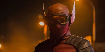 Abimana Aryasatya as Sancaka wearing a red and black superhero costume in Gundala