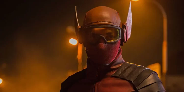 Abimana Aryasatya as Sancaka wearing a red and black superhero costume in Gundala