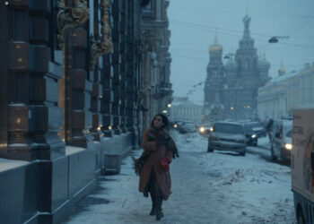 Salome Demuria as Medea walking down a snowy street in The Antique.