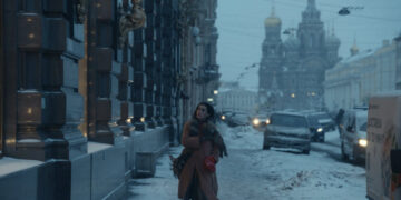 Salome Demuria as Medea walking down a snowy street in The Antique.