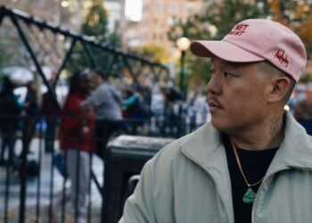 Eddie Huang staring off in front of a playground in Vice Is Broke