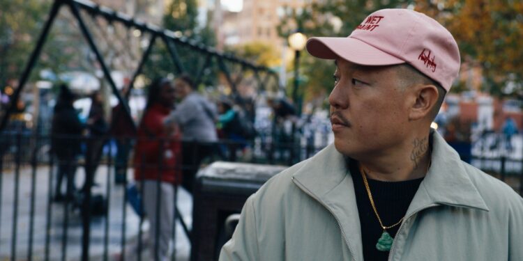 Eddie Huang staring off in front of a playground in Vice Is Broke
