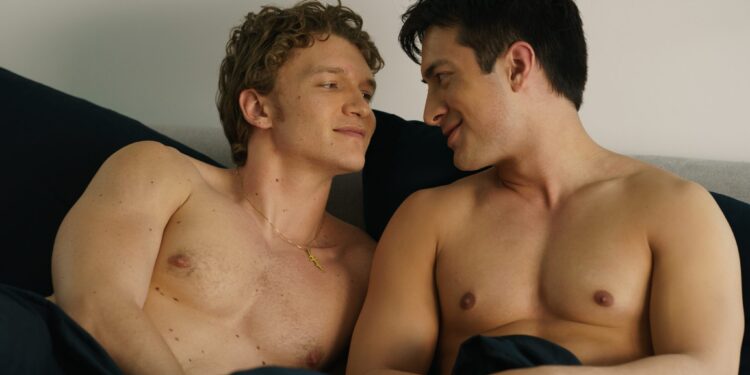 Connor Storrie as Ilya Rozanov and Hudson Williams as Shane Hollander in bed on the TV series Heated Rivalry.