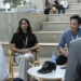 Meaghan Rath as Anushka Bhattachera-Phister and Curtis Lum as Tim Kwan sitting at a table in The Audacity