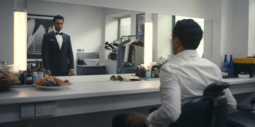 Riz Ahmed as Shah Latif prepares to audition for James Bond in Bait