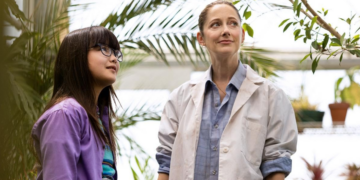 Lexi Perkel as Callie and Judy Greer as Mrs. G standing together inside a greenhouse in Mabel