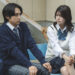 KANON as Johnny Yoyogi and Mio Matsuda as Atsuko sitting on a bench in Yoyogi Johnny