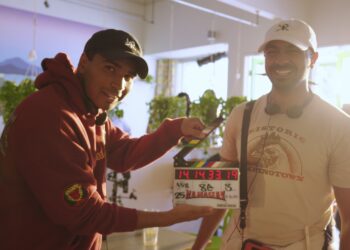 Directors Rish and Kanish holding a clapper on the set of their movie Namaslay.
