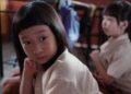 Ong Xuan Jing as Ah Girl sitting in a classroom in Ah Girl.